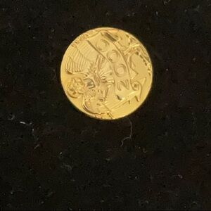 Intricate Gold Coin with Detailed Design